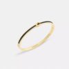 Bracciale rigido sottile smaltato con chiusura a cerniera e firma del marchio