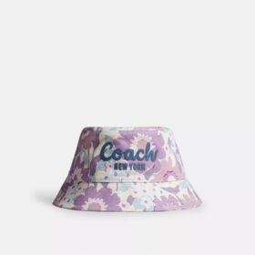 Cappello a secchiello con stampa floreale e scritta Coach in corsivo
