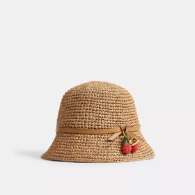Cappello a secchiello in paglia con dettaglio a forma di ciliegia