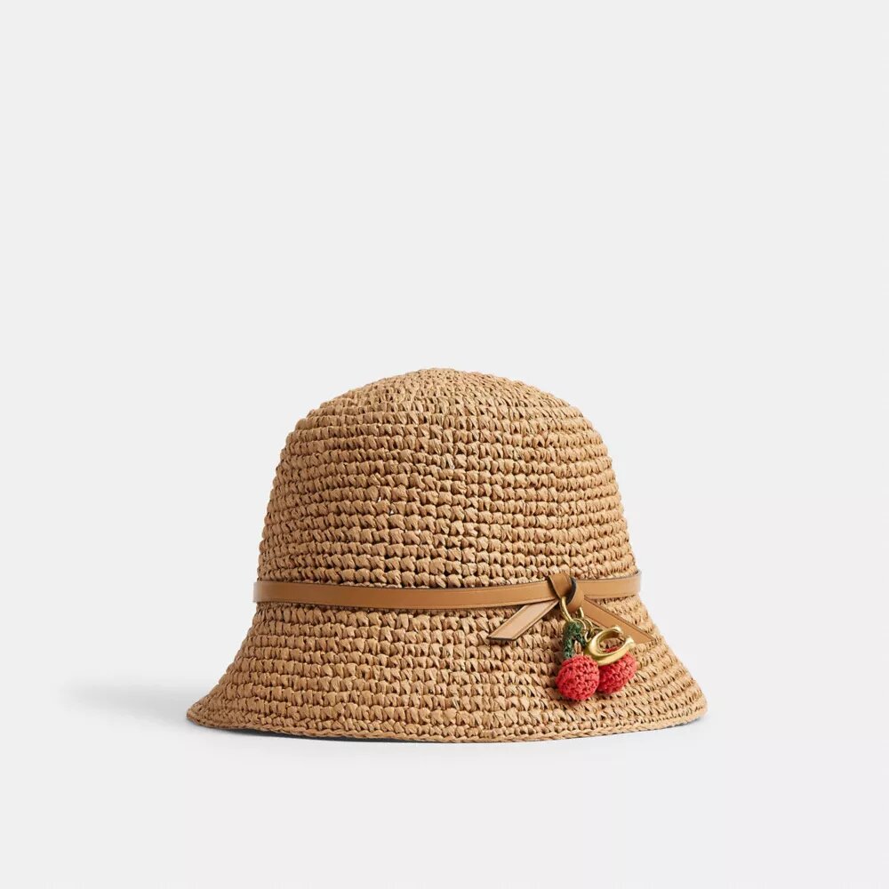 Cappello a secchiello in paglia con dettaglio a forma di ciliegia