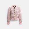 Cardigan con cuoricini rimpiccioliti