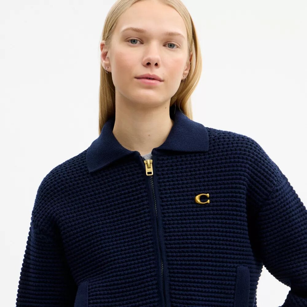 Cardigan con zip frontale