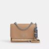 Ciondolo per borsa con chiusura a scatto in Signature Canvas con ciondolo