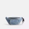 Marsupio Travis 35 in denim consumato con ciondoli