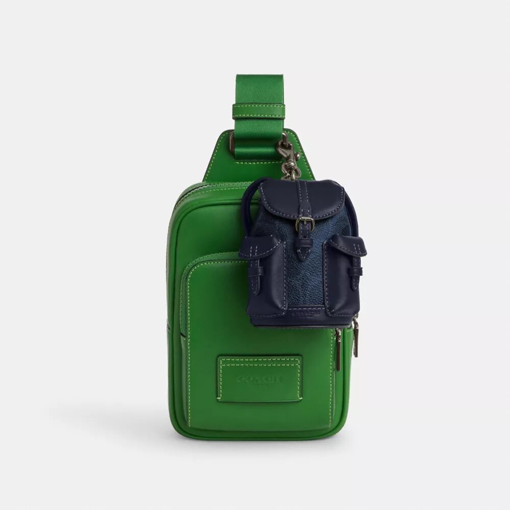 Mini ciondoli per zaini Warner in Signature Canvas