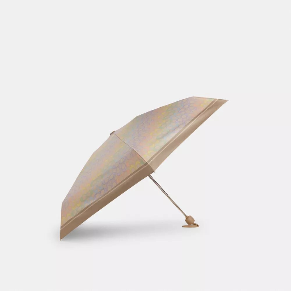 Mini ombrello con protezione UV nella stampa arcobaleno firmata