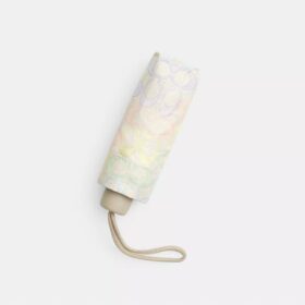 Mini ombrello con protezione UV nella stampa arcobaleno firmata