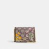 Mini portafoglio con catena in jacquard esclusivo con ricamo floreale