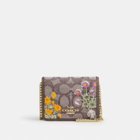 Mini portafoglio con catena in jacquard esclusivo con ricamo floreale