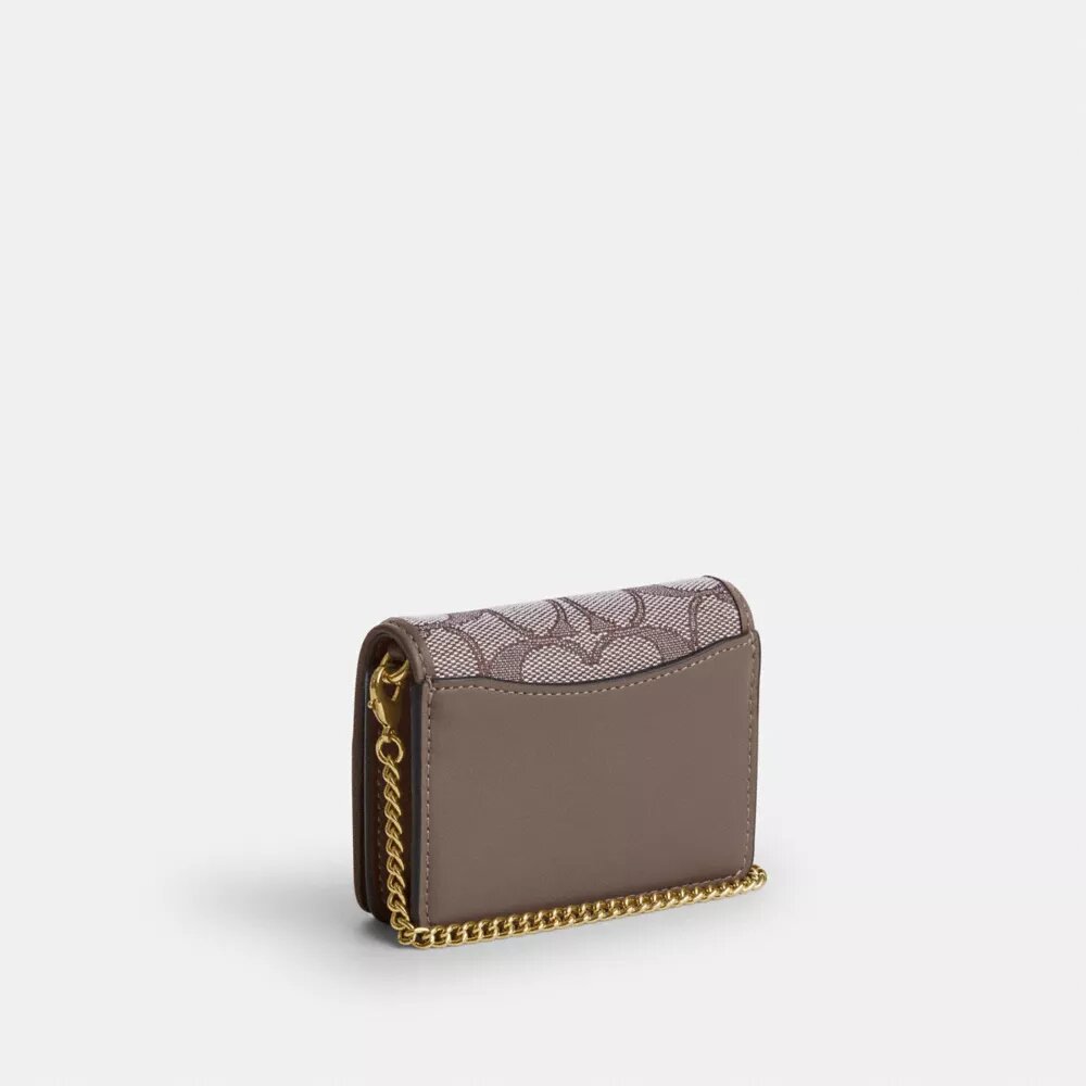 Mini portafoglio con catena in jacquard esclusivo con ricamo floreale