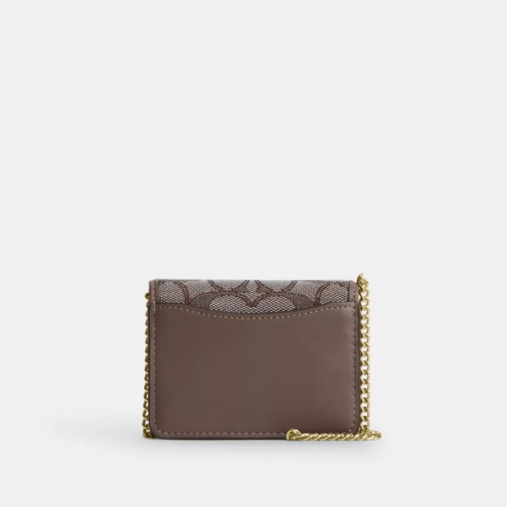 Mini portafoglio con catena in jacquard esclusivo con ricamo floreale