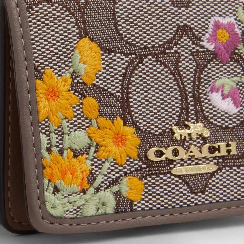 Mini portafoglio con catena in jacquard esclusivo con ricamo floreale