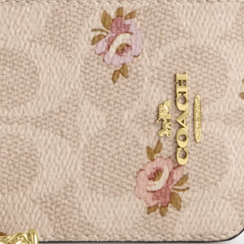 Portacarte con cerniera in Signature Canvas con stampa floreale