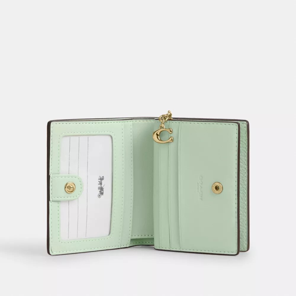 Portafoglio con chiusura a scatto e stampa floreale