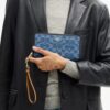 Portafoglio lungo con chiusura a zip perimetrale in denim Signature