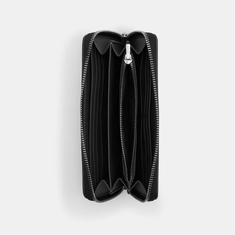 Portafoglio lungo con chiusura a zip perimetrale in jacquard esclusivo