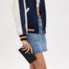 Portafoglio lungo con chiusura a zip perimetrale in jacquard esclusivo