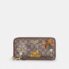Portafoglio lungo con chiusura a zip perimetrale in jacquard Signature con ricami floreali