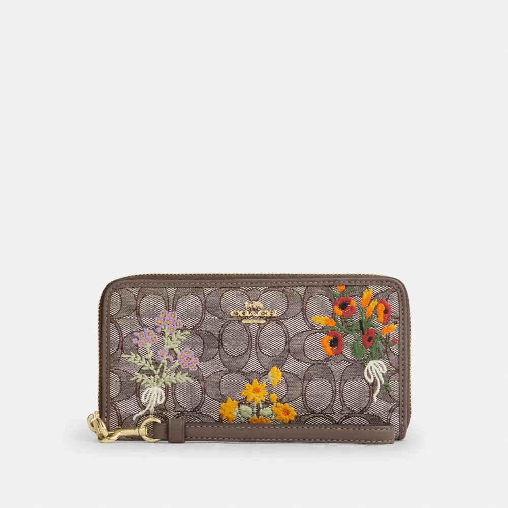 Portafoglio lungo con chiusura a zip perimetrale in jacquard Signature con ricami floreali