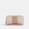 Portafoglio lungo con chiusura a zip perimetrale in Signature Canvas a righe