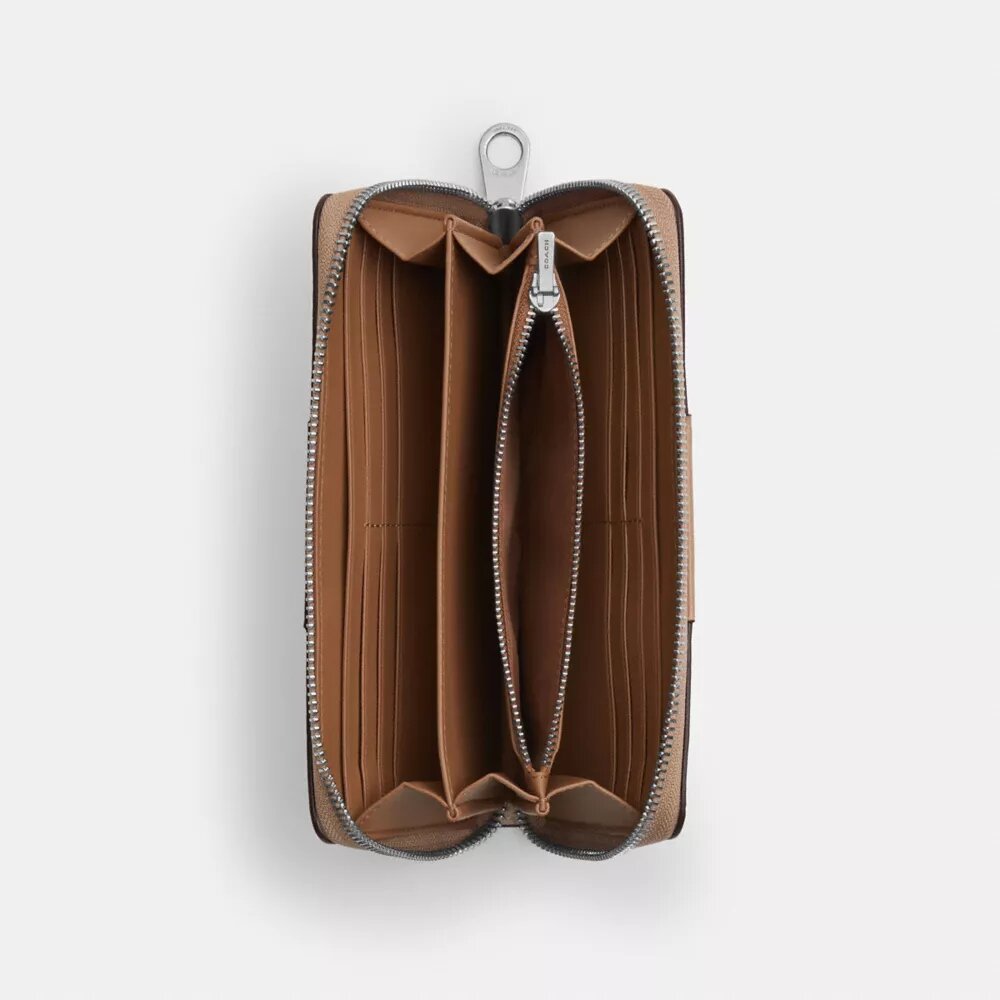Portafoglio lungo con chiusura a zip perimetrale in Signature Canvas a righe