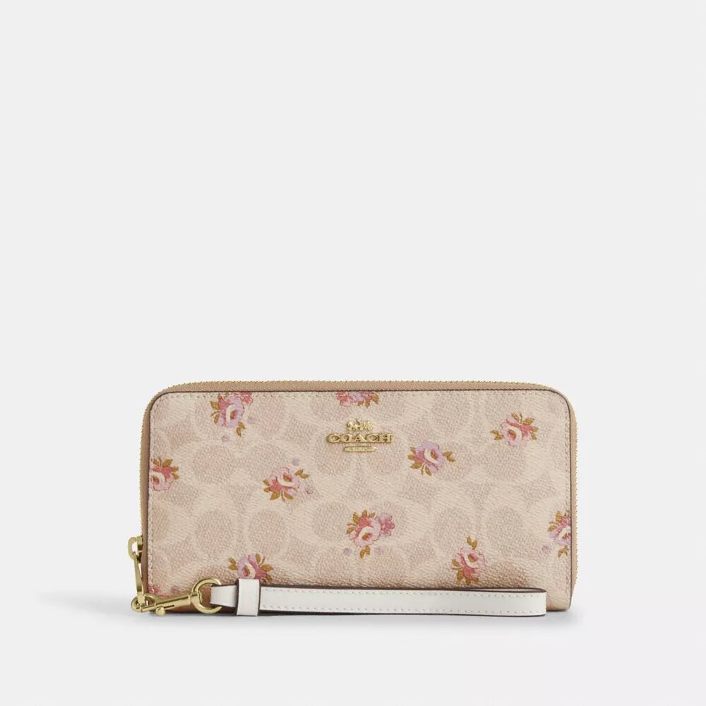 Portafoglio lungo con chiusura a zip su tutto il perimetro in Signature Canvas con stampa floreale