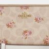 Portafoglio lungo con chiusura a zip su tutto il perimetro in Signature Canvas con stampa floreale