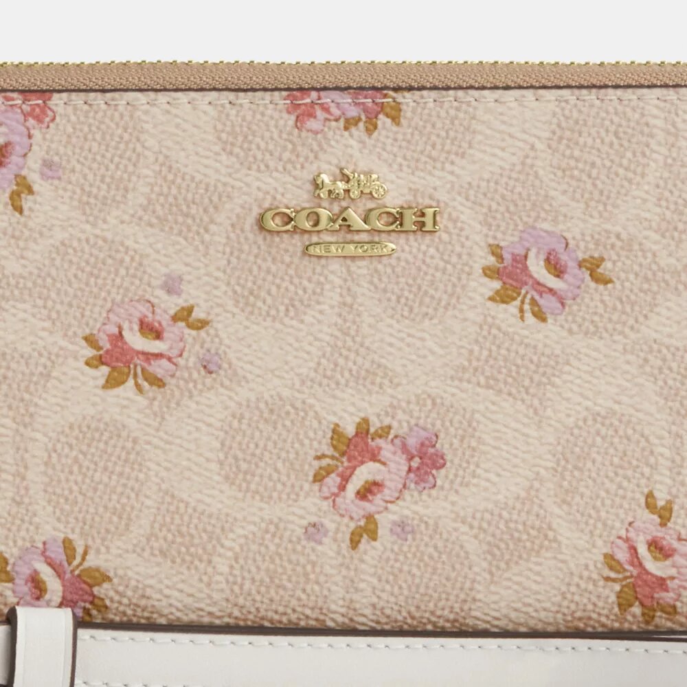 Portafoglio lungo con chiusura a zip su tutto il perimetro in Signature Canvas con stampa floreale