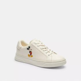 Sneaker alte Disney X Coach con Topolino