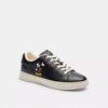 Sneaker alte Disney X Coach con Topolino