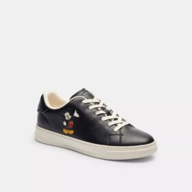 Sneaker alte Disney X Coach con Topolino