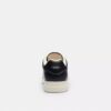 Sneaker alte Disney X Coach con Topolino
