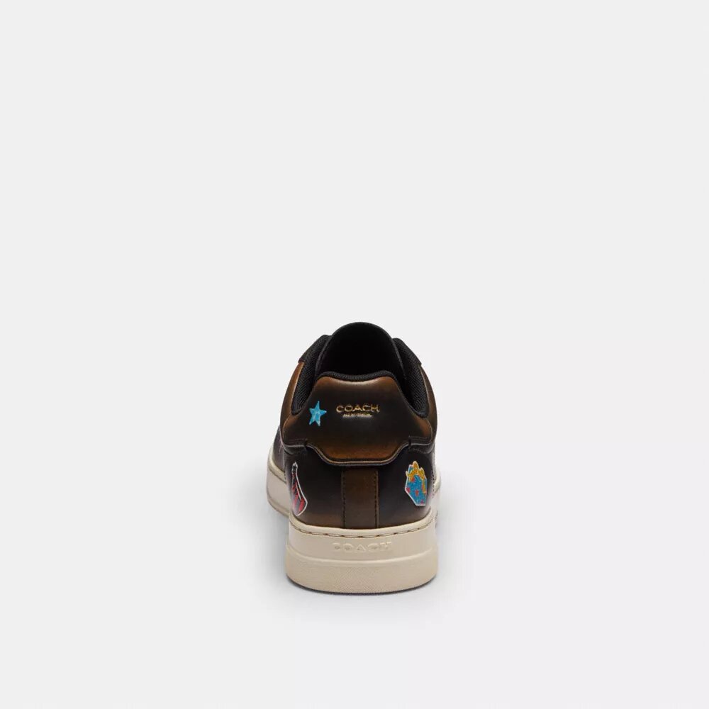 Sneaker Rexy alte per il 10° compleanno con stampa adesivi
