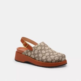 Zoccoli con plateau con "C" scolpita in tessuto jacquard esclusivo